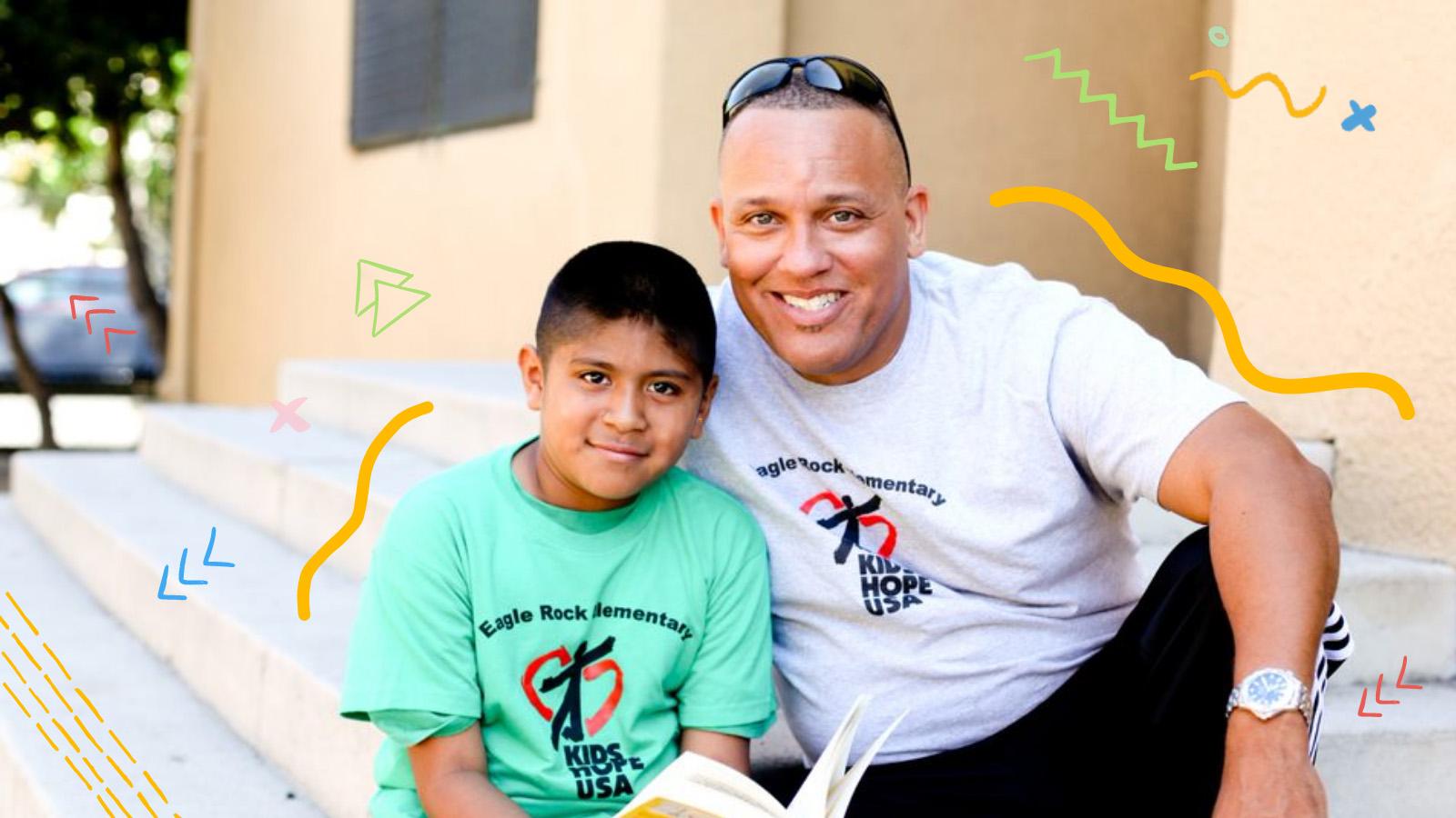 About - Image Only Male mentor and student sitting outside